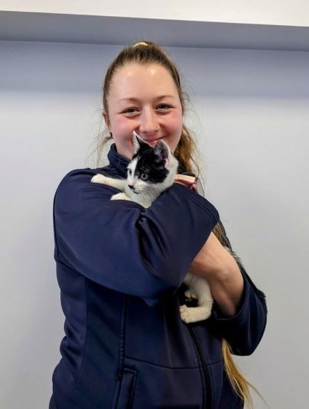 Amy Barnard with black and white kitten Dotty