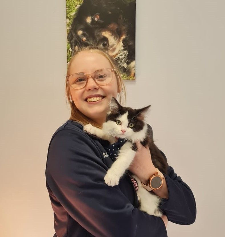 Meg Sutton with her black and white cat Dotty